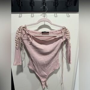 Light pink with ties on the arm top